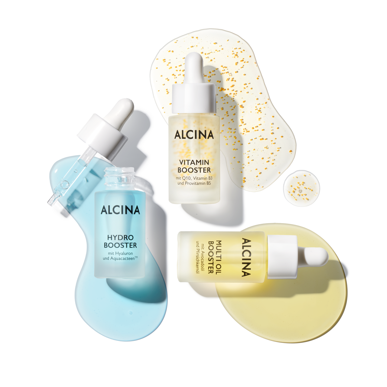 Drei liegende Glasflacons mit Pipette und Produkt